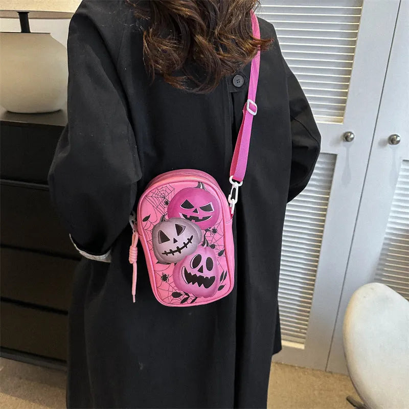 Halloween graffiti print crossbody bag showing pumpkin, ghost and bat designs in medium 14x23x9.5cm size