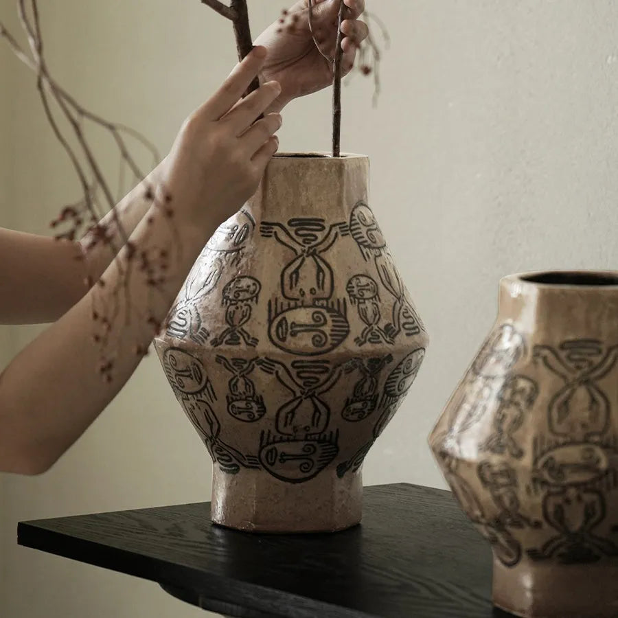 Hand-painted ceramic vase with carved tribal totem flower pattern in cylindrical shape