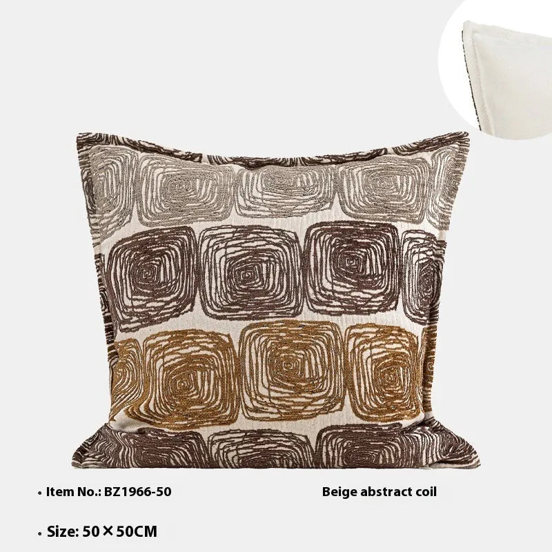 Cream and coffee-coloured abstract coil pattern on square and rectangular polyester pillow covers.