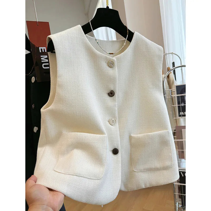 Women's milky white French-style bandage vest with round neck and sleeveless design on a hanger.