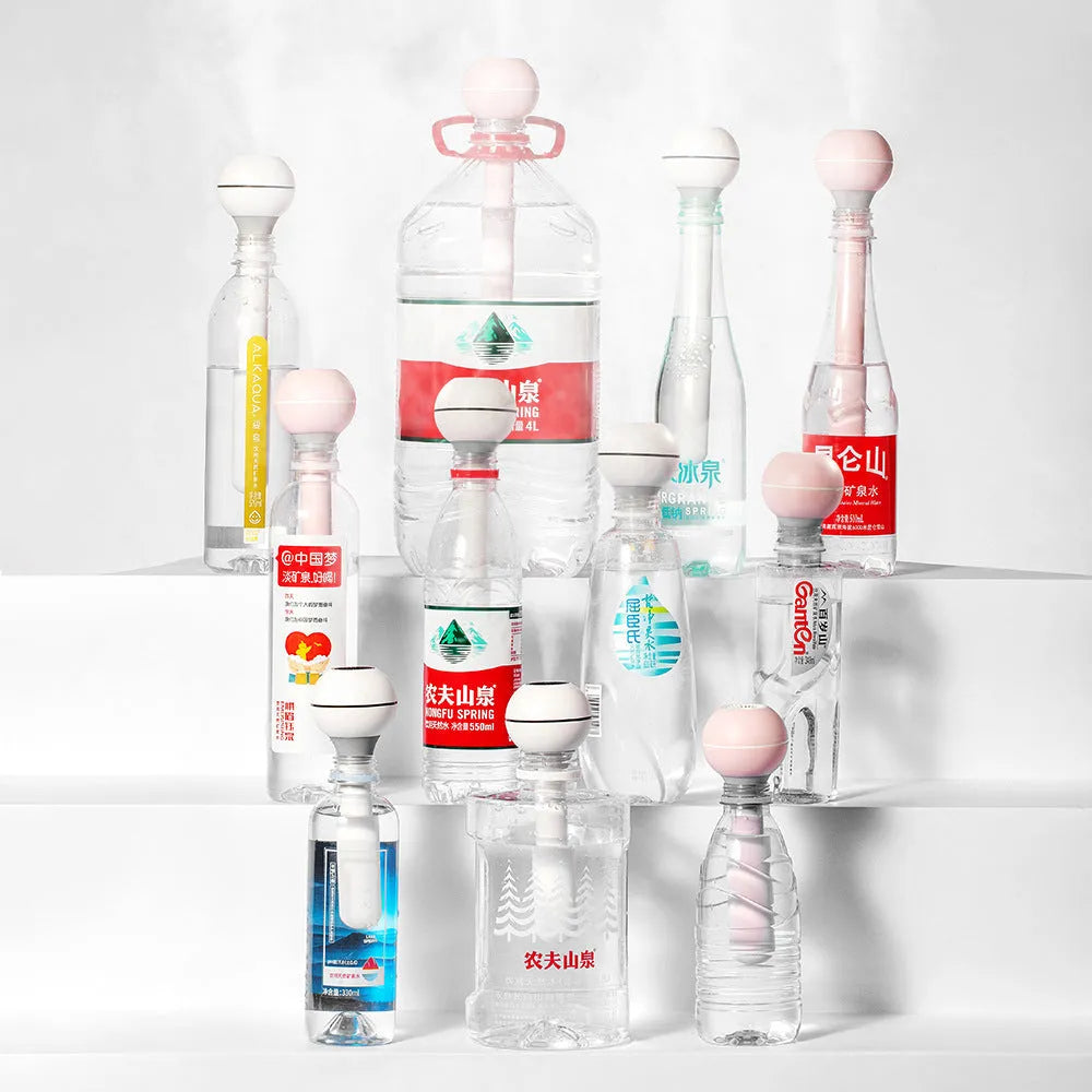 White columnar Magic Wand ultrasonic humidifier with USB cable and mist output.
