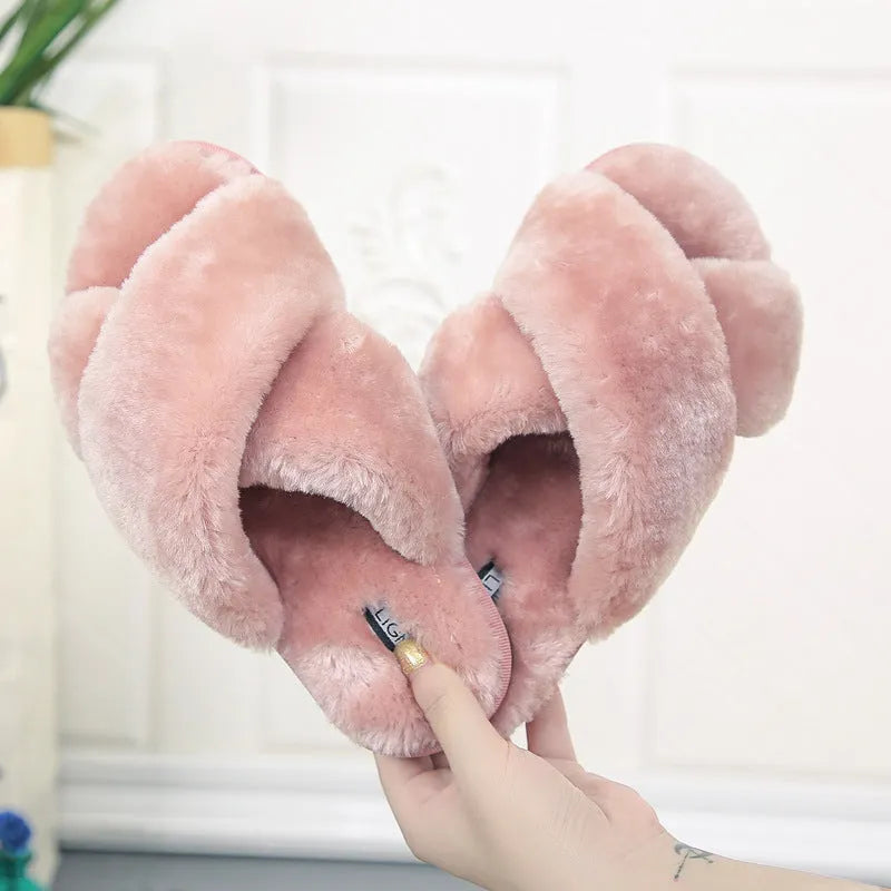 Cross strap open-toe fur slippers in multiple colours on a non-slip rubber sole.