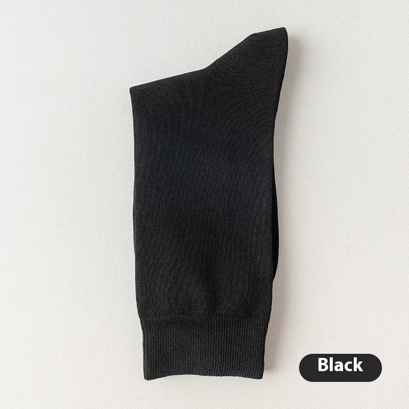 Men's solid colour pure cotton mid-calf business socks in beige, black, grey and blue shown folded.