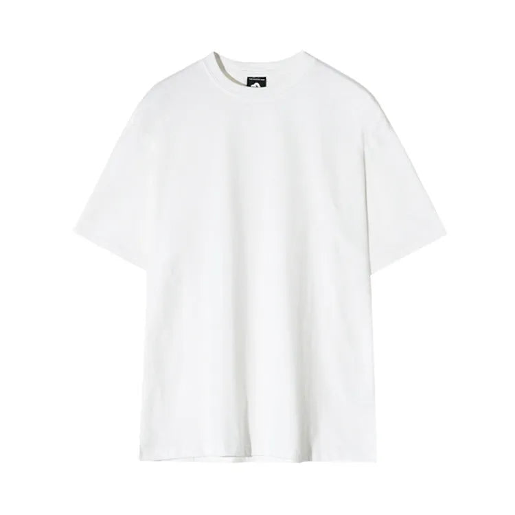 A man's slim-fit cotton T-shirt in solid white, showing the regular half-length sleeves and round neck.