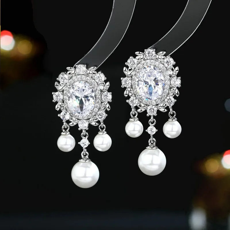 Oval geometric pearl tassel earrings with zircon stones in light purple colour