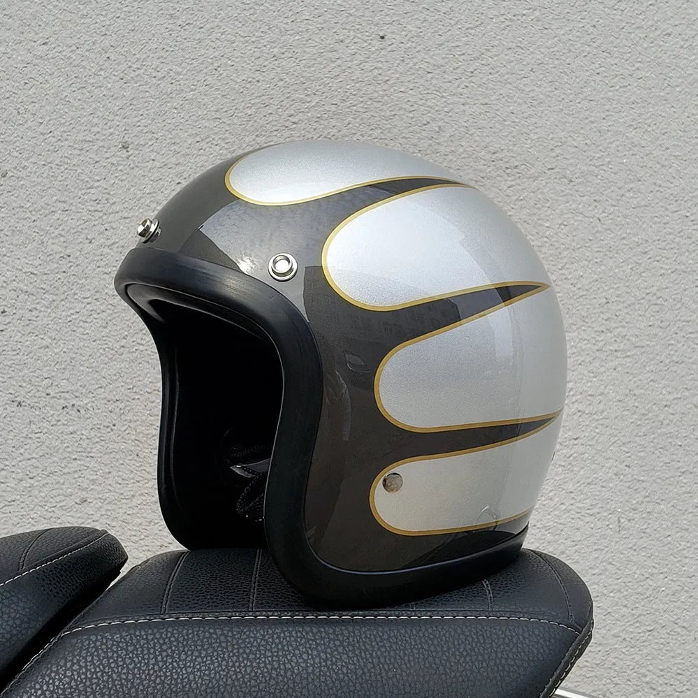 Glass fibre retro half motorcycle helmet shown in multiple colour options including cement grey and matte black flower patterns