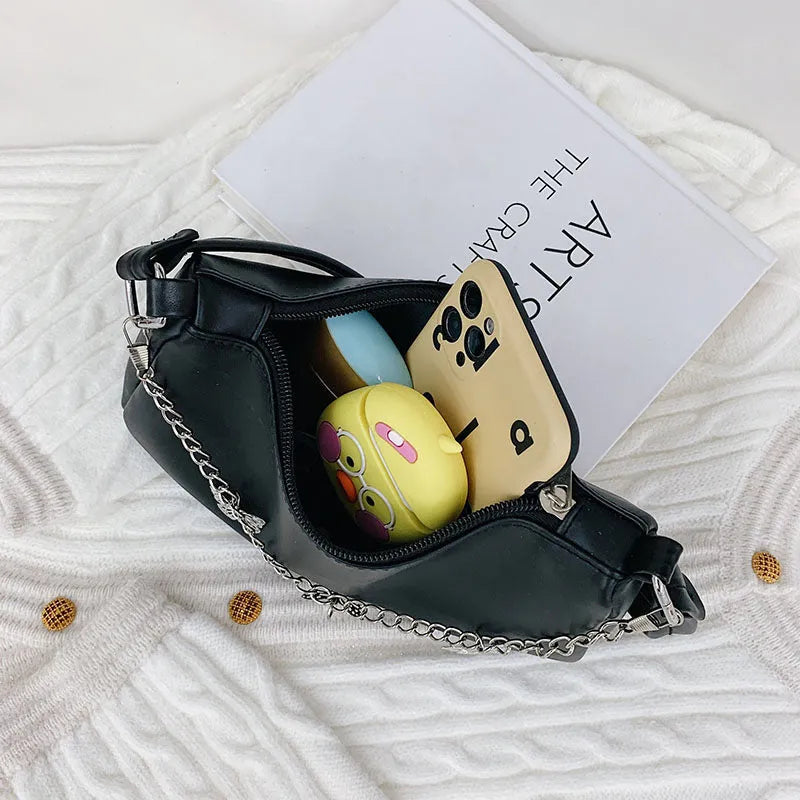 Butterfly chain crossbody bag in PU leather with a retro style, shown in light blue.