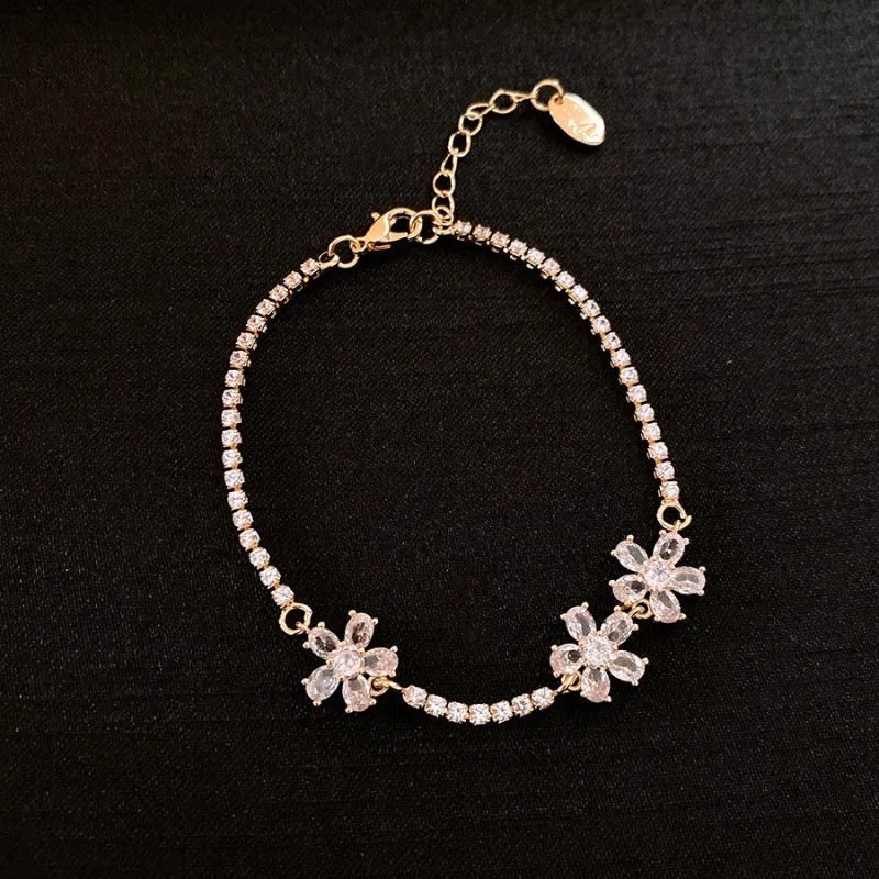 Gold copper bracelet with geometric design and inlaid zircon stones for women