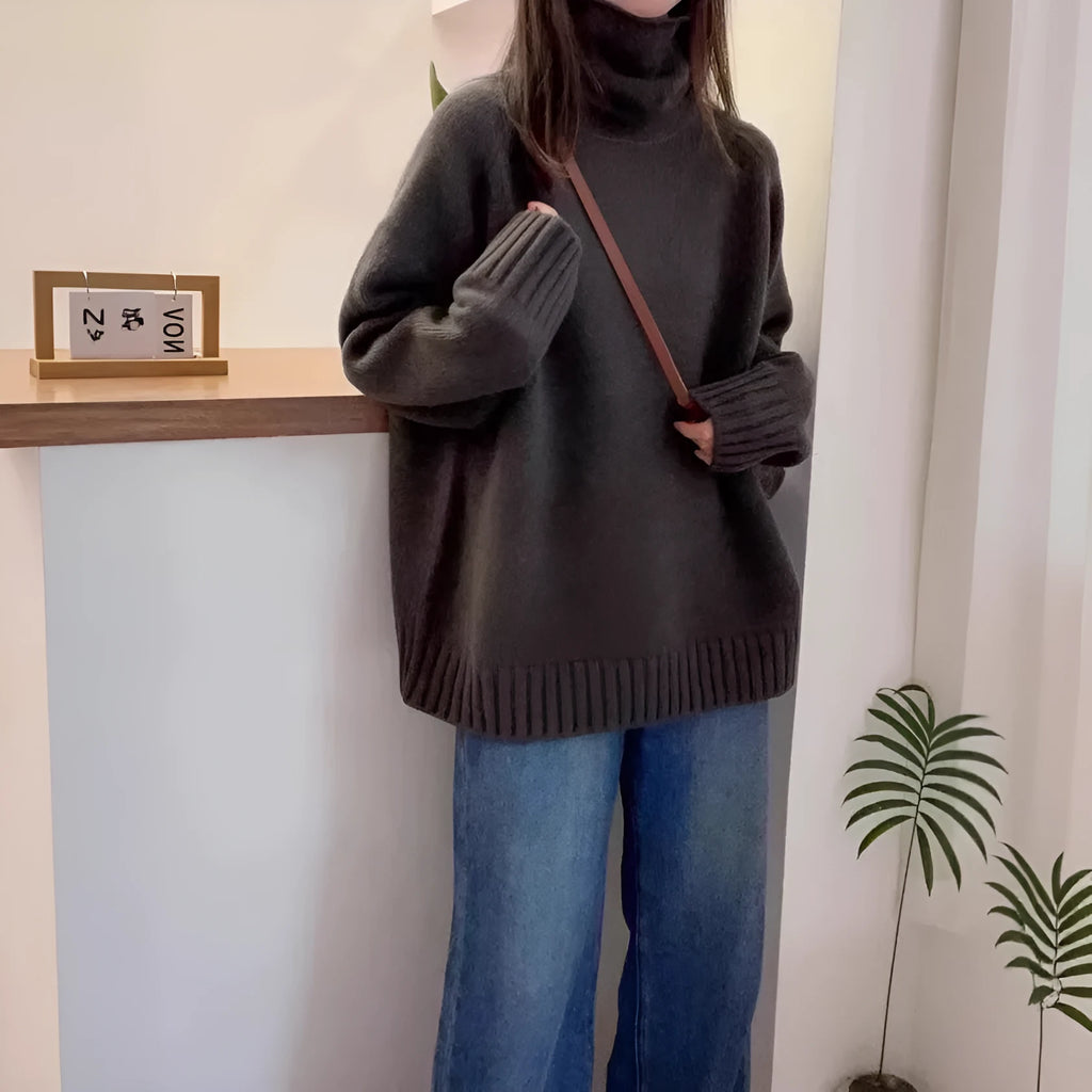 Women's loose-fit turtleneck sweater with thick curling pile collar in black, camel, grey, or red.