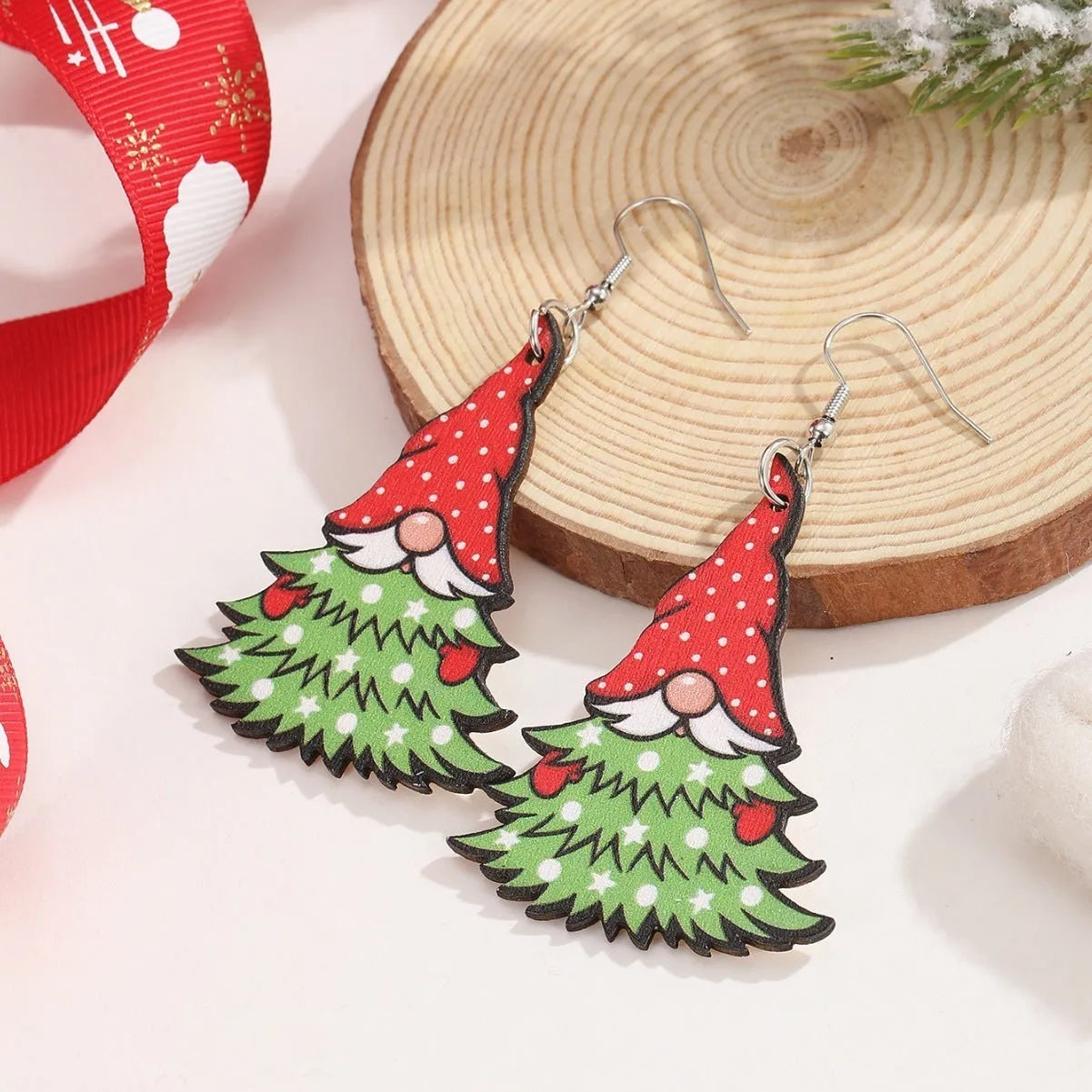 Wooden Christmas earrings with geometric shapes and printed Santa Claus designs