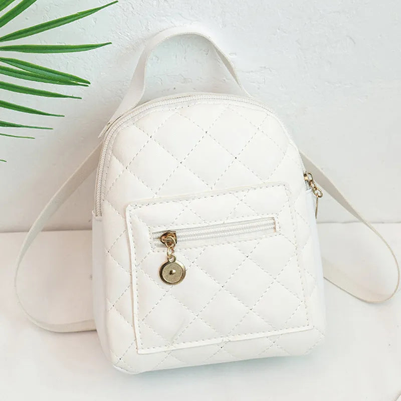 Girls' Korean style embroidered backpack in hard PU material showing vertical square shape and sandwich pocket