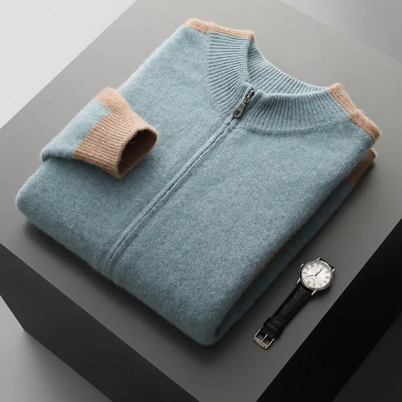 Man wearing a dark blue half turtleneck zipper cardigan made of thick rough wool yarn.
