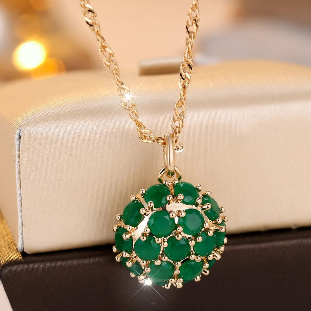 Round emerald and diamond necklace with champagne gold finish and adjustable chain