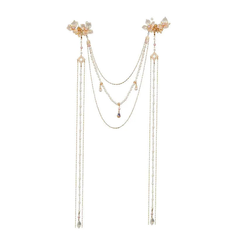 Gold-coloured acrylic hairpin with a pearl diamond flower and long tassel decoration.