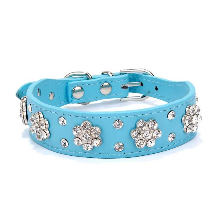 Black PU leather dog collar with rhinestone flowers and metal studs, showing the adjustable eyelets and D-ring.