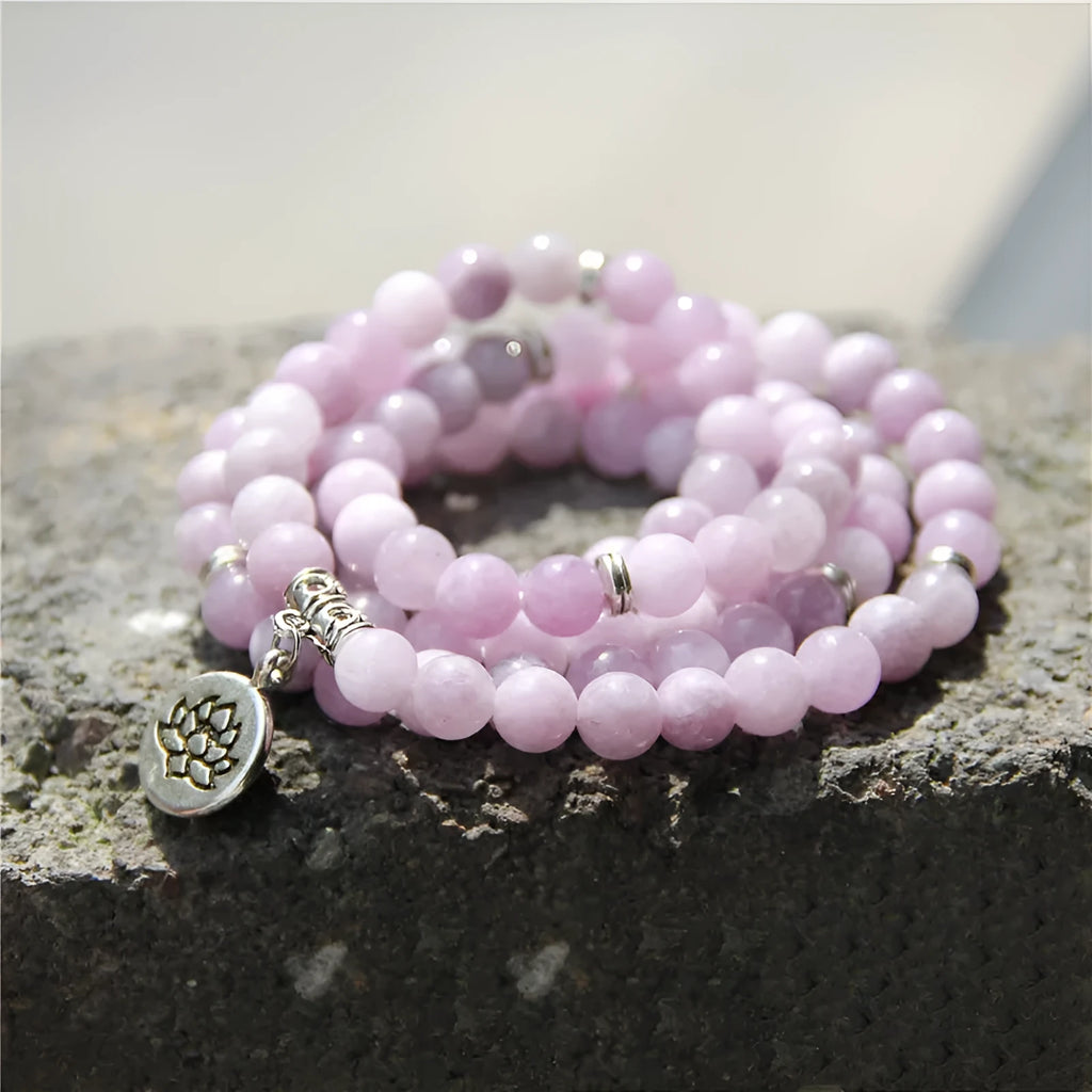Women's vintage-style bracelet with a natural stone angel echeveria lotus pendant on a chain.