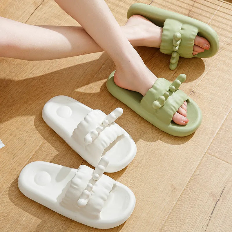 Women's deer horn design flip flop slippers in light yellow EVA material with hollow-out pattern.