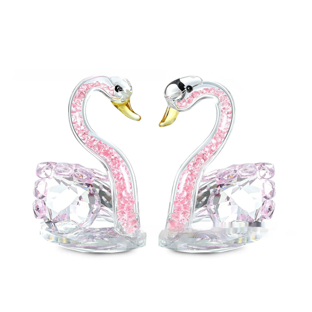 Crystal swan desktop ornament in red, blue, pink, or purple on a wooden surface.