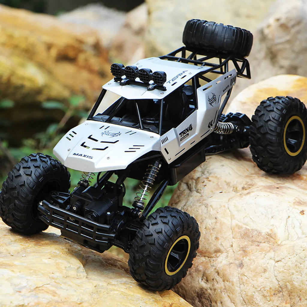 Large 4WD remote control climbing car with 2.4G wireless remote on off-road terrain