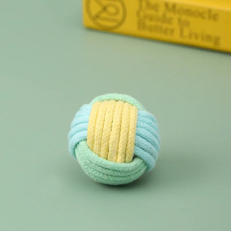 Handmade plush cotton cat hair ball toy in mixed colours, shown next to a ruler indicating 5cm size.