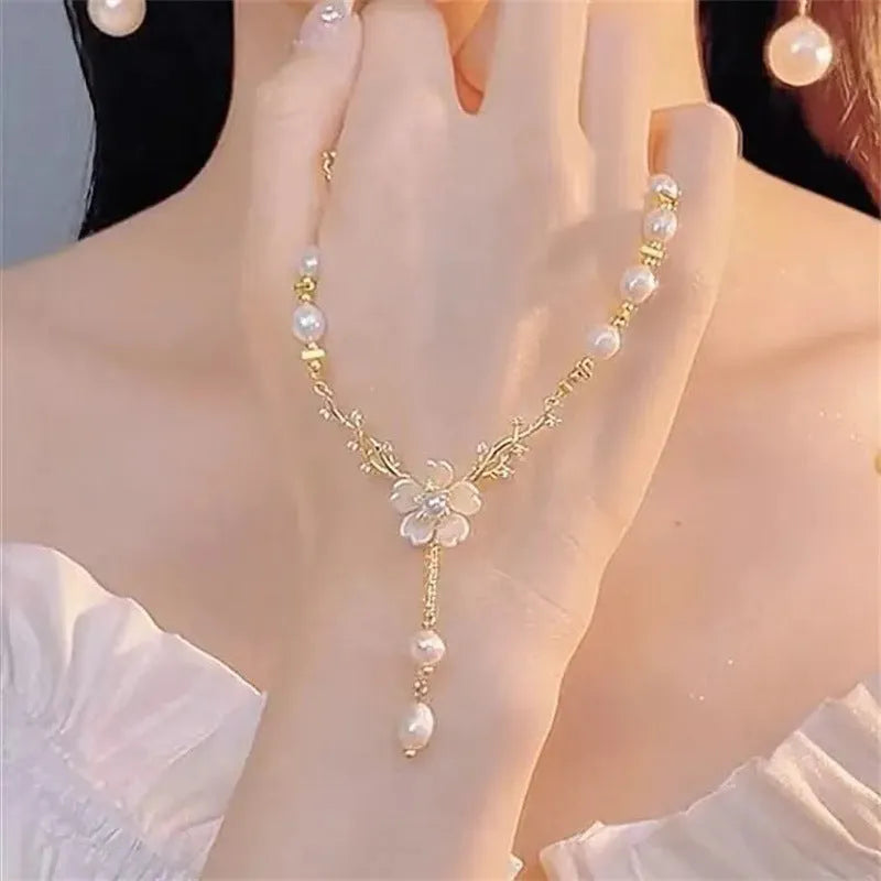 Alloy pearl flower necklace with rose accents on model