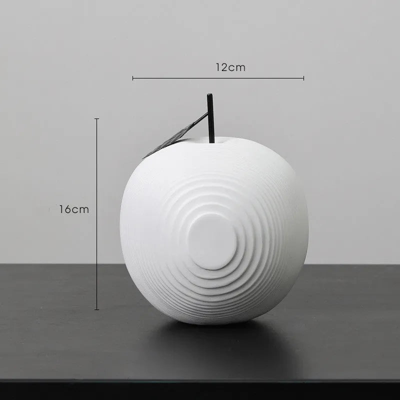 Resin decorative crafts set showing high black apple and low white pear sculptures
