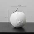 Resin decorative crafts set showing high black apple and low white pear sculptures