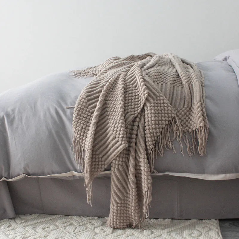 Small polyester fibre nap blanket measuring 127cm by 170cm in dark grey colour