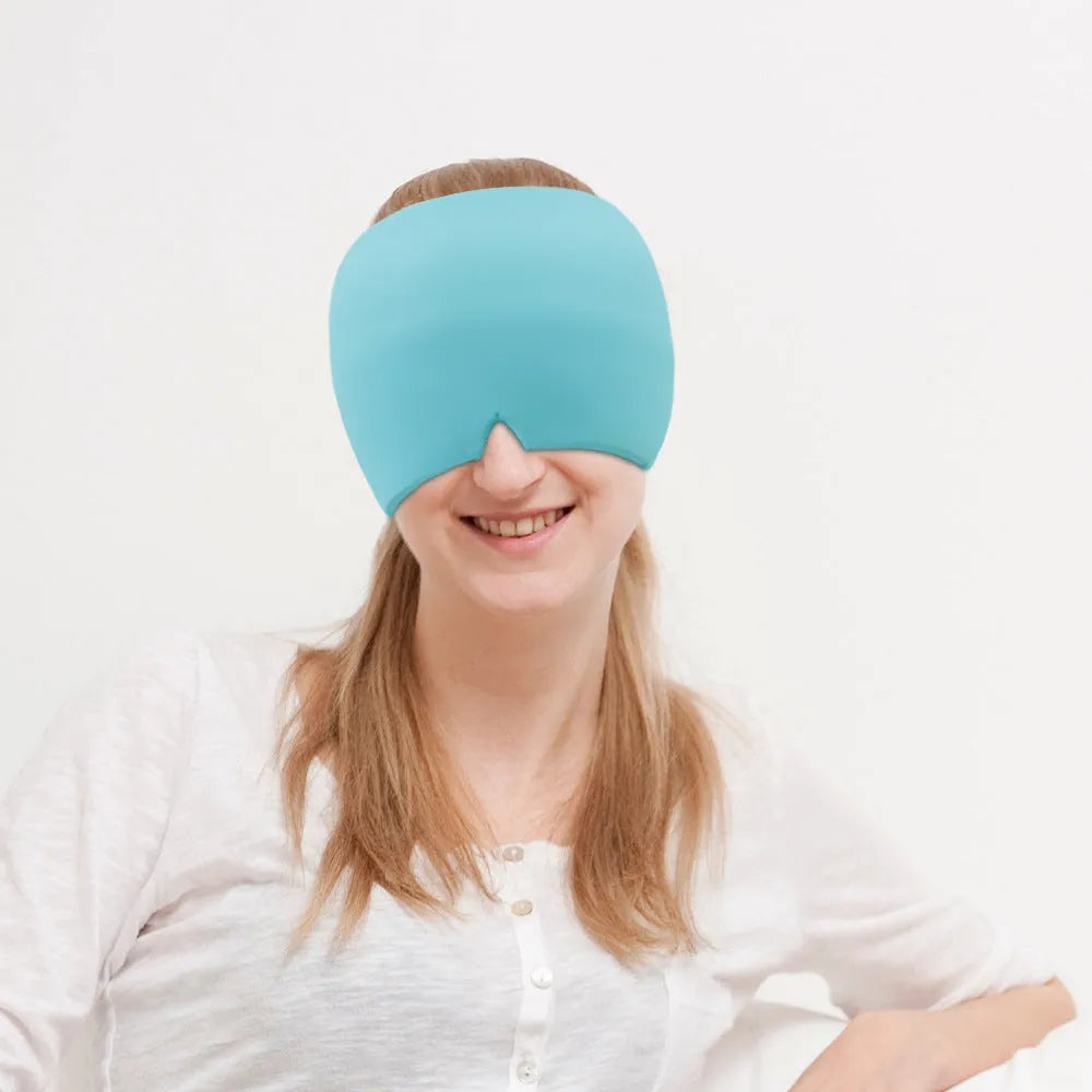 Black elastic cloth gel cold therapy eye mask for headache relief on grey background.