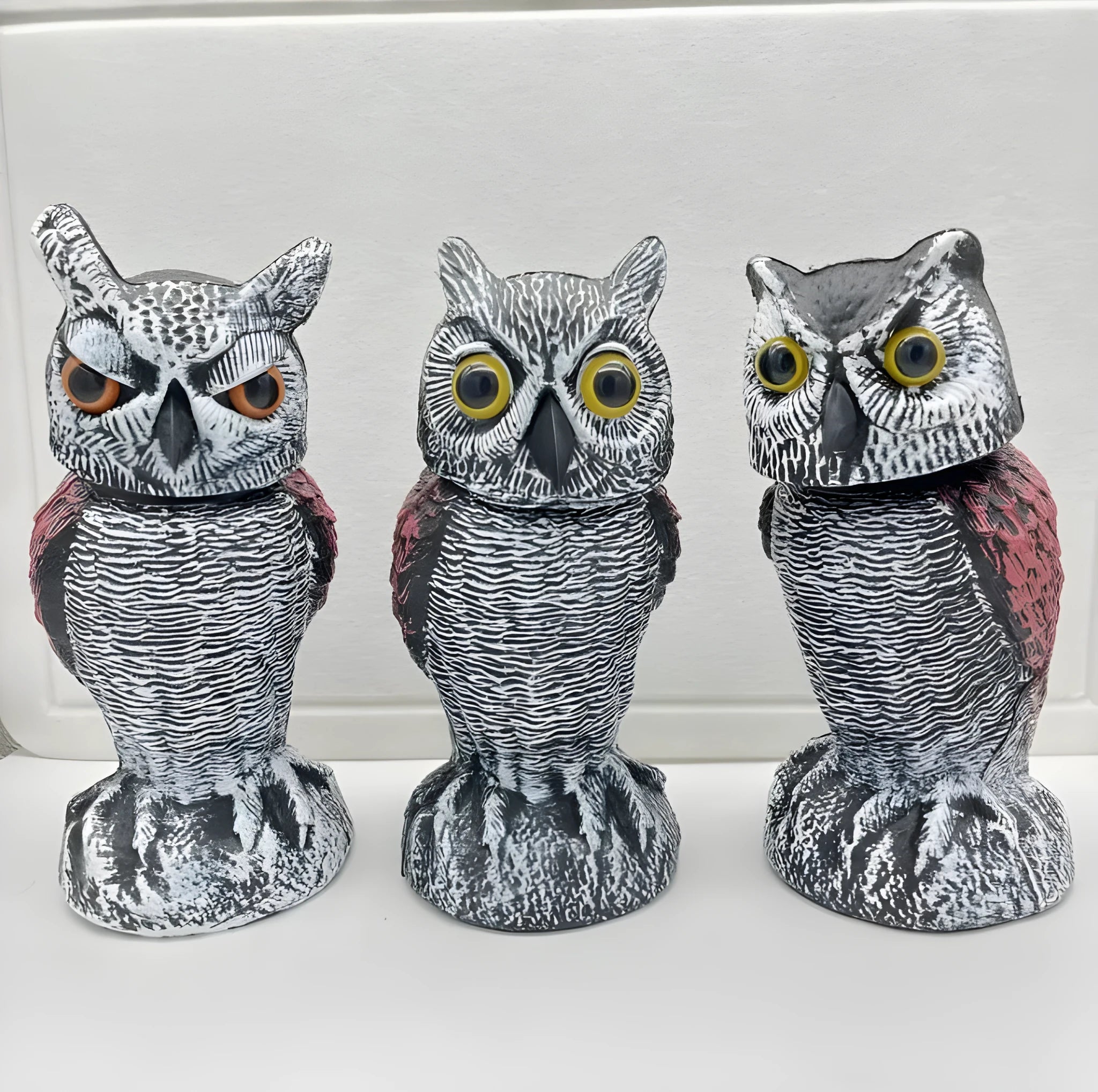 Artificial owl bird deterrent decoy with realistic features for outdoor garden use