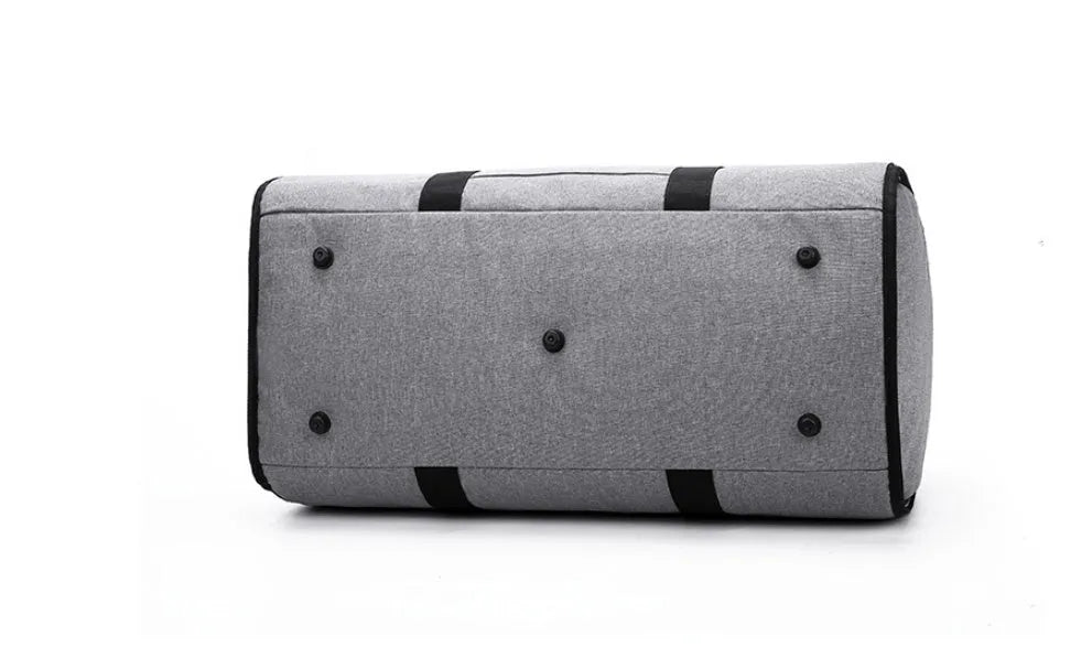 Medium-sized cylindrical travel bag in Oxford cloth, shown in one of four colours: black, blue, light grey, or red.