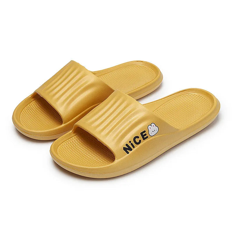 Pair of minimalist EVA flip flop slippers in a choice of six colours, showing the injection moulded non-slip sole.
