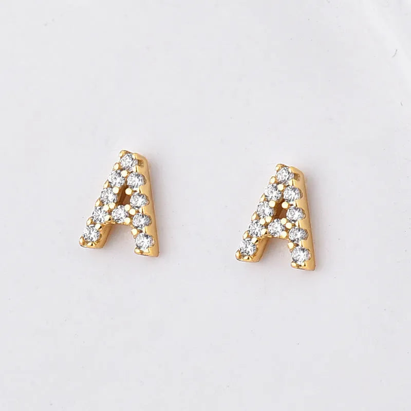 Brass gold plated alphabet letter earrings showing English character design with zircon elements