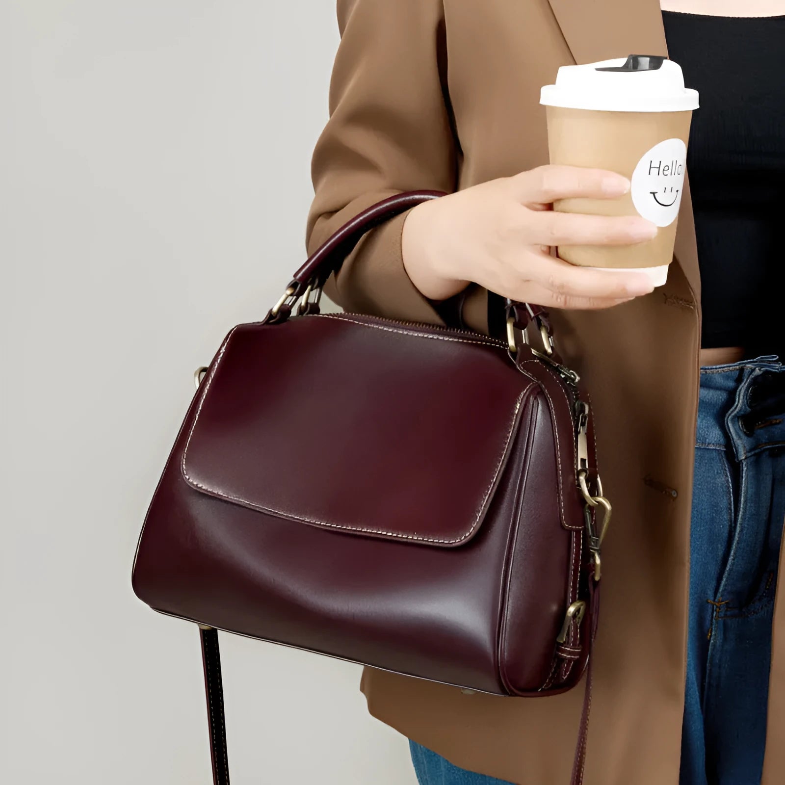 Genuine leather crossbody tote bag in a cross square shape with double straps and internal organiser pockets.