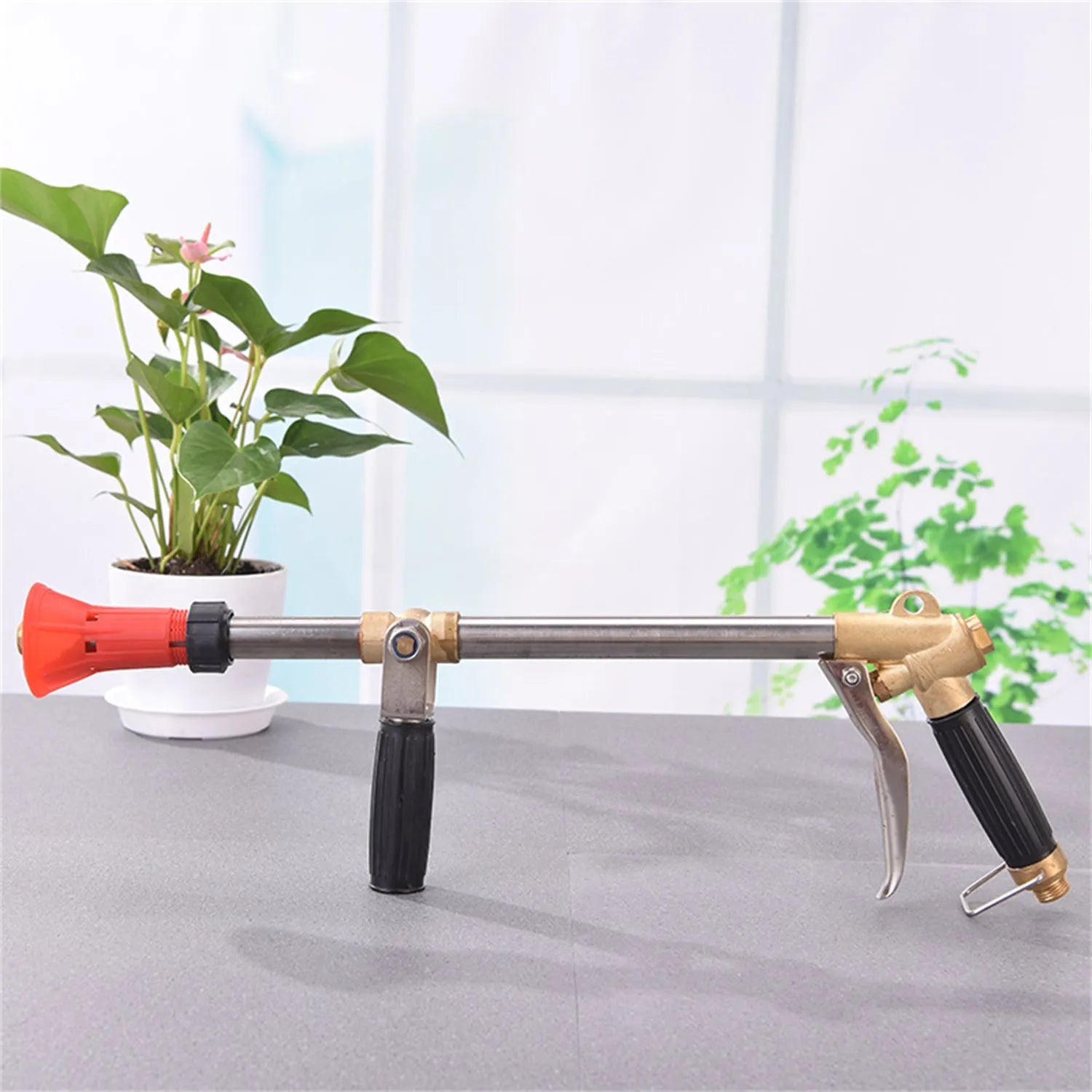 Plastic agricultural spray gun with submachine gun style handle and adjustable pressure control