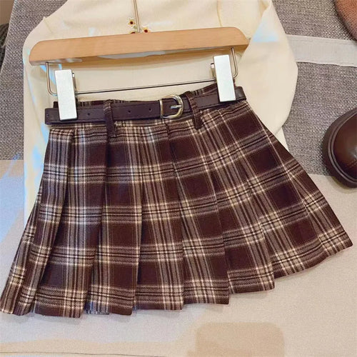 Girls' plaid pleated A-line skirt with an elastic waistband on a hanger.