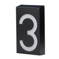 Solar-powered white LED house number light mounted on an outdoor wall