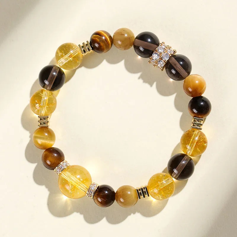 Natural yellow 10mm artificial crystal bead bracelet with an adjustable string tie.