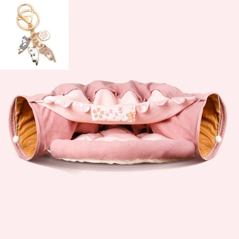 Collapsible cloth cat tunnel in Pink colour, shown extended for play.