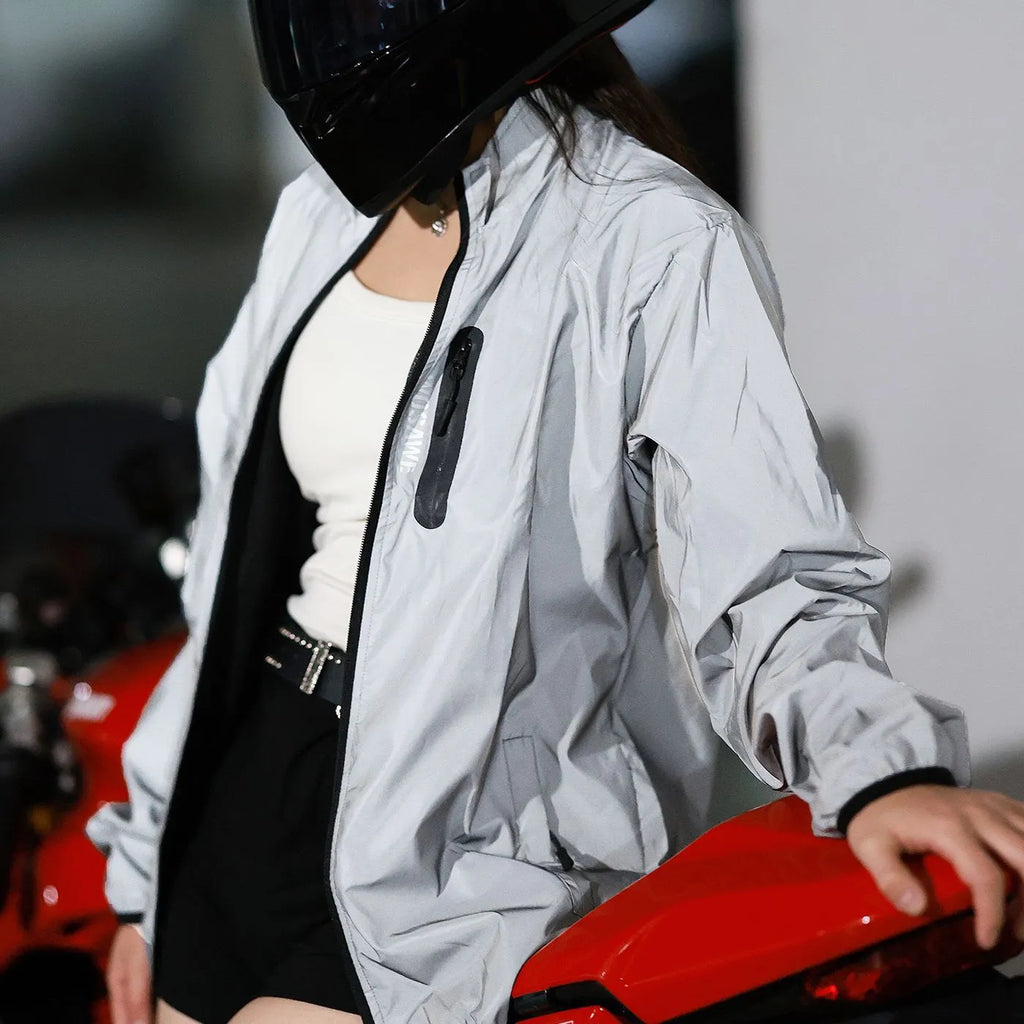 Silver waterproof polyester long sleeved windproof coat showing front design.