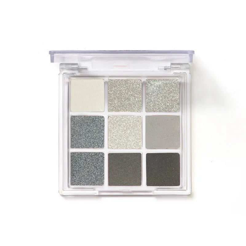 Smoked case nine colour eye shadow palette showing white, silver, black, and iron grey shades