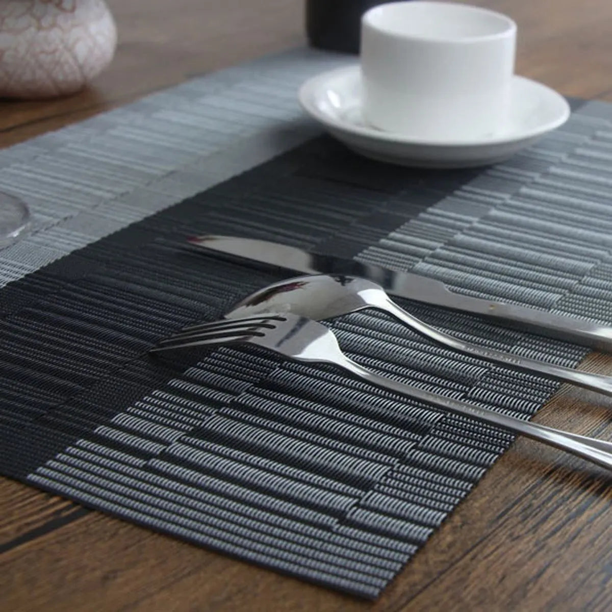 Modern PVC non-slip placemat in gradient bamboo colour on a table.