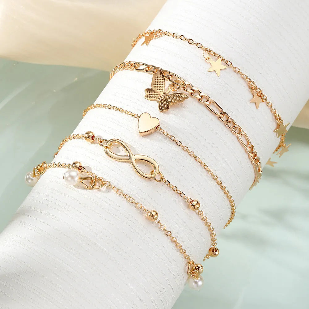 Butterfly pearl heart anklet jewellery set with four coordinated alloy foot chains