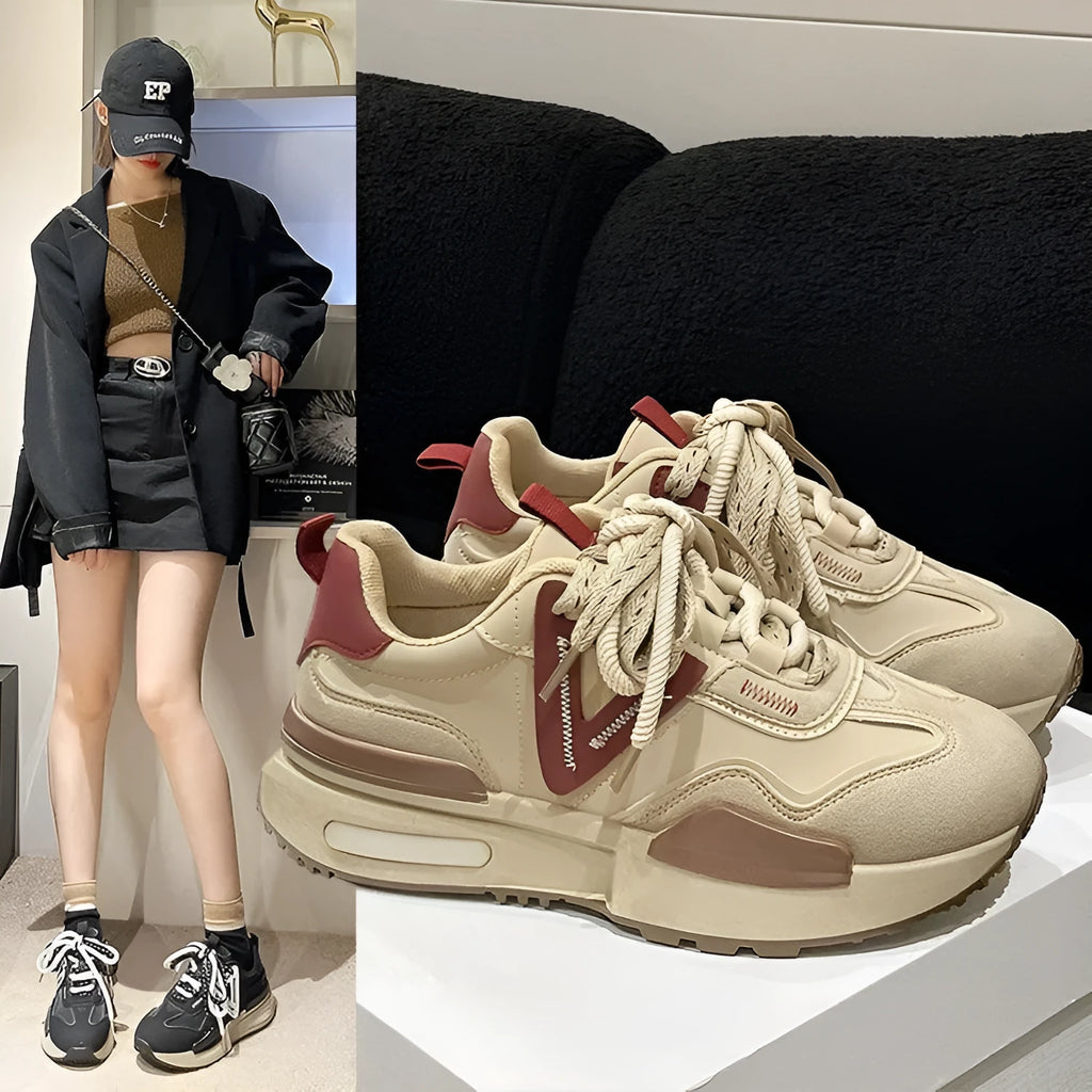 Women's black retro platform lace-up sneakers with a round toe and rubber sole.