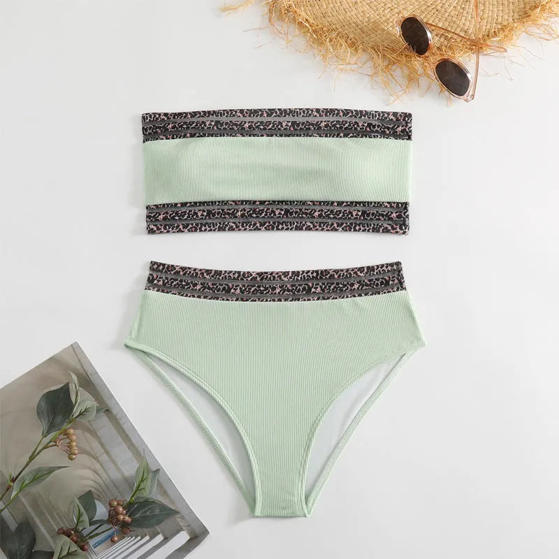 Black strapless bikini set with contrasting leopard print panels on the bra and shorts.