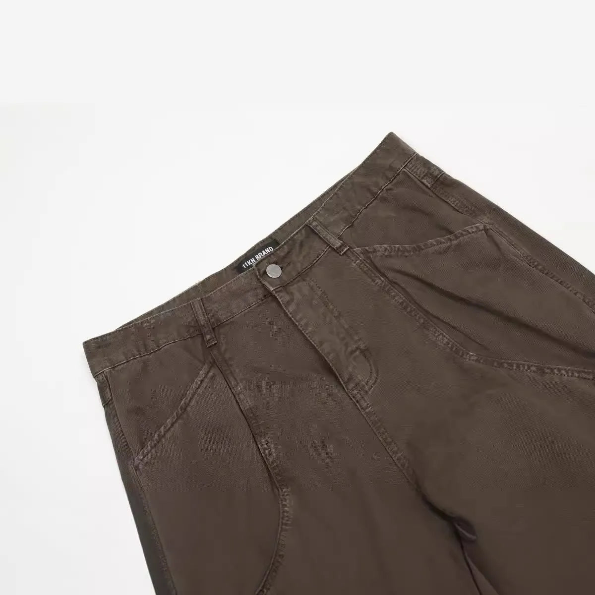 Men's brown straight-leg cotton trousers with high-waist design and zipper fly opening