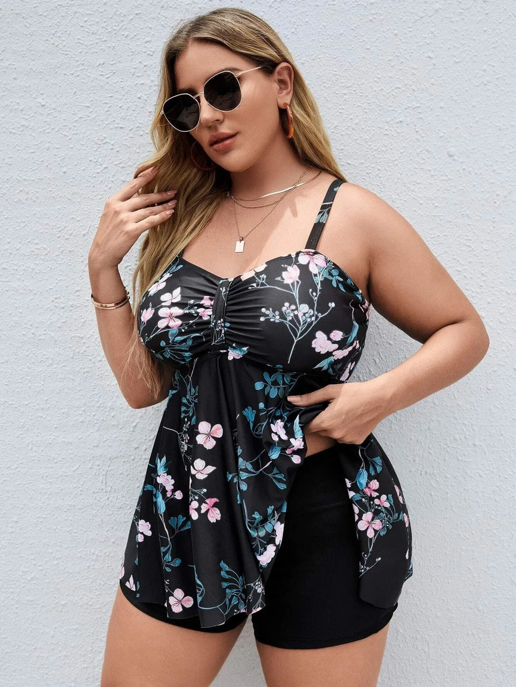 Women's one-piece floral print swimsuit with split colours, shown in extended sizes.