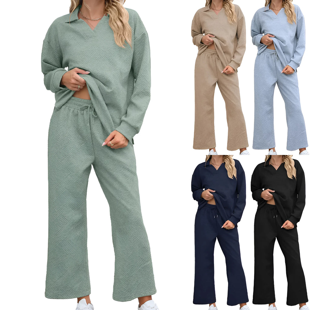 Women's black geometric pattern knitted suit set with long sleeve top and elastic waist cropped trousers.