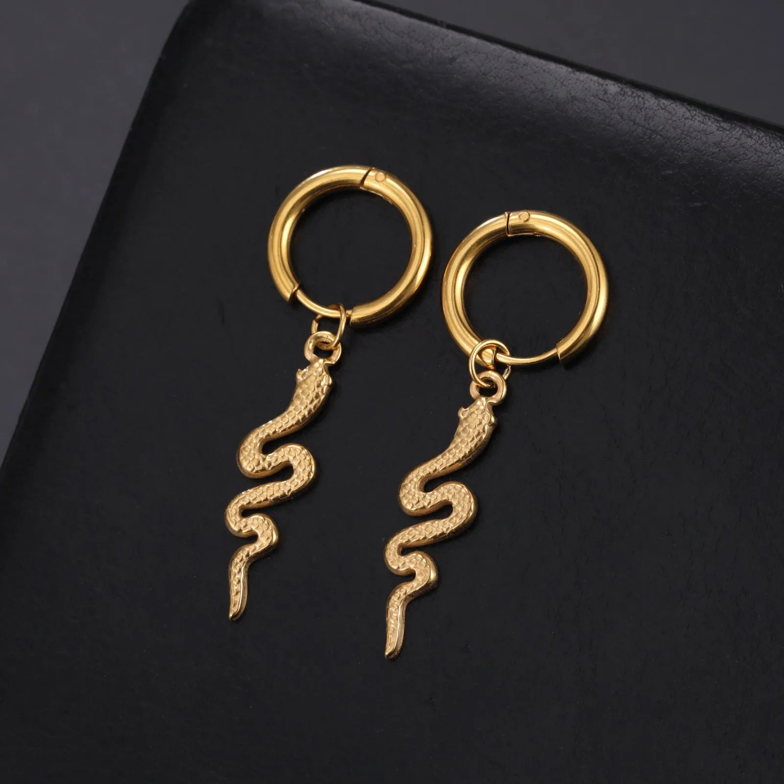 Stainless steel snake vintage earrings with gold plating and ear clip design