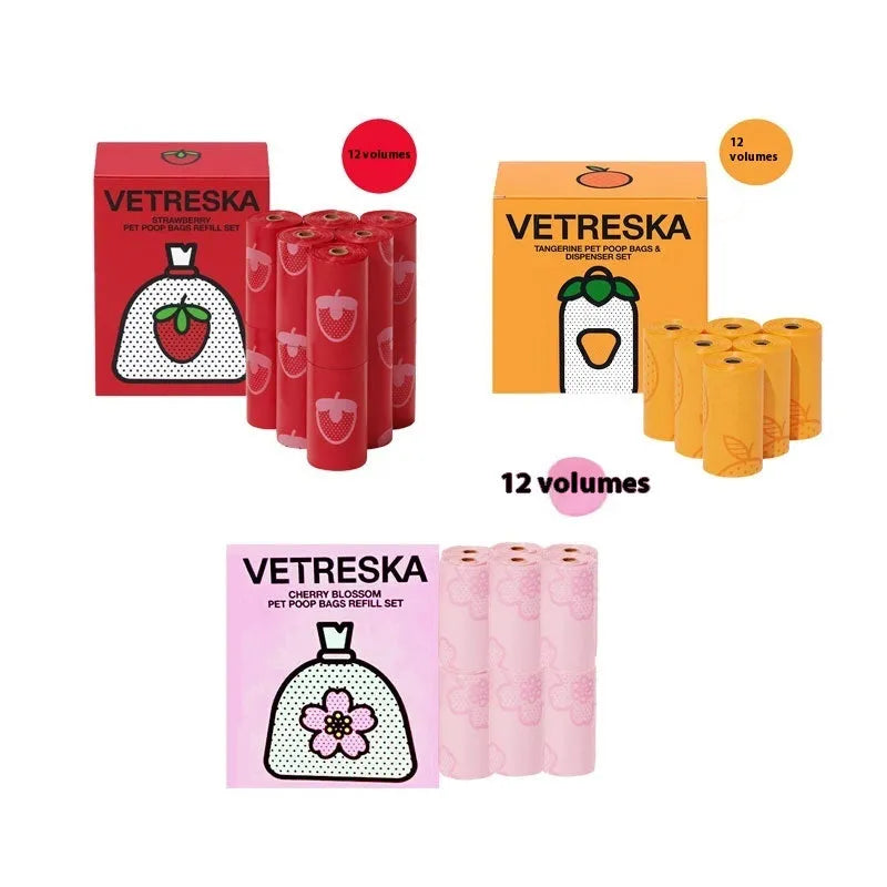 Portable dog poo bag dispenser capsule with strawberry design and a roll of scented biodegradable bags.